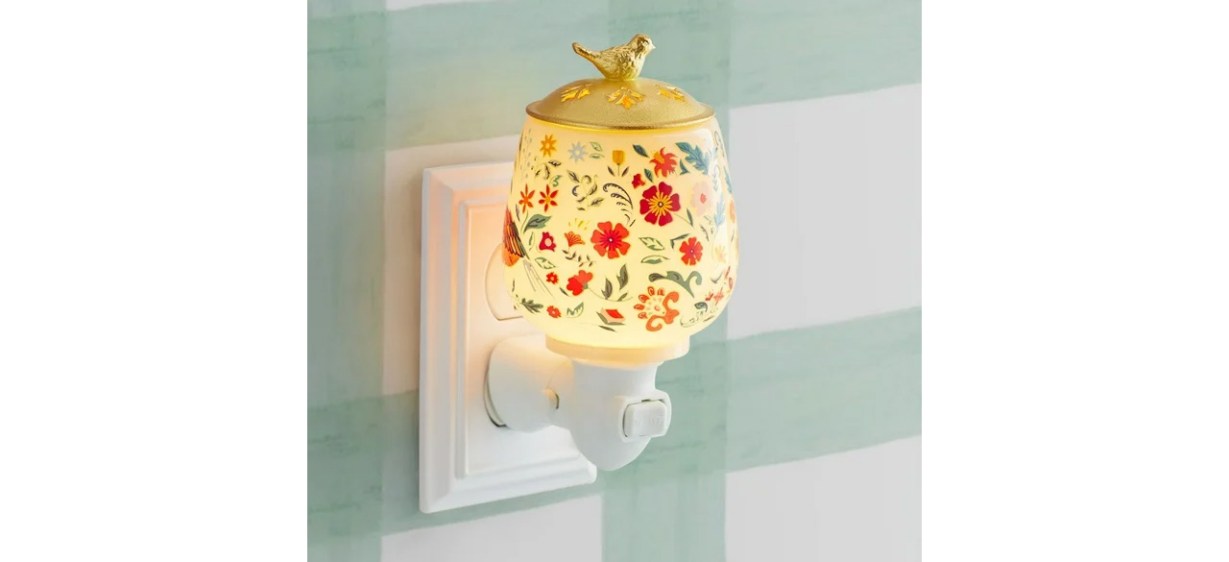 Pioneer Woman Accent Wax Warmer, Birdie Botanical plugged into wall