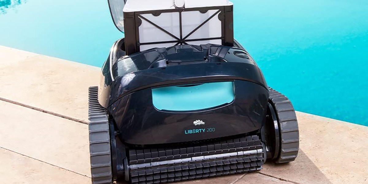 Dolphin Liberty 200 Cordless Robotic Pool Vacuum Cleaner next to pool