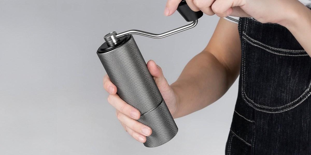 Person Timemore Chestnut C2 Manual Coffee Grinder