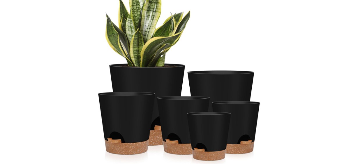 Six black planters of varying sizes.