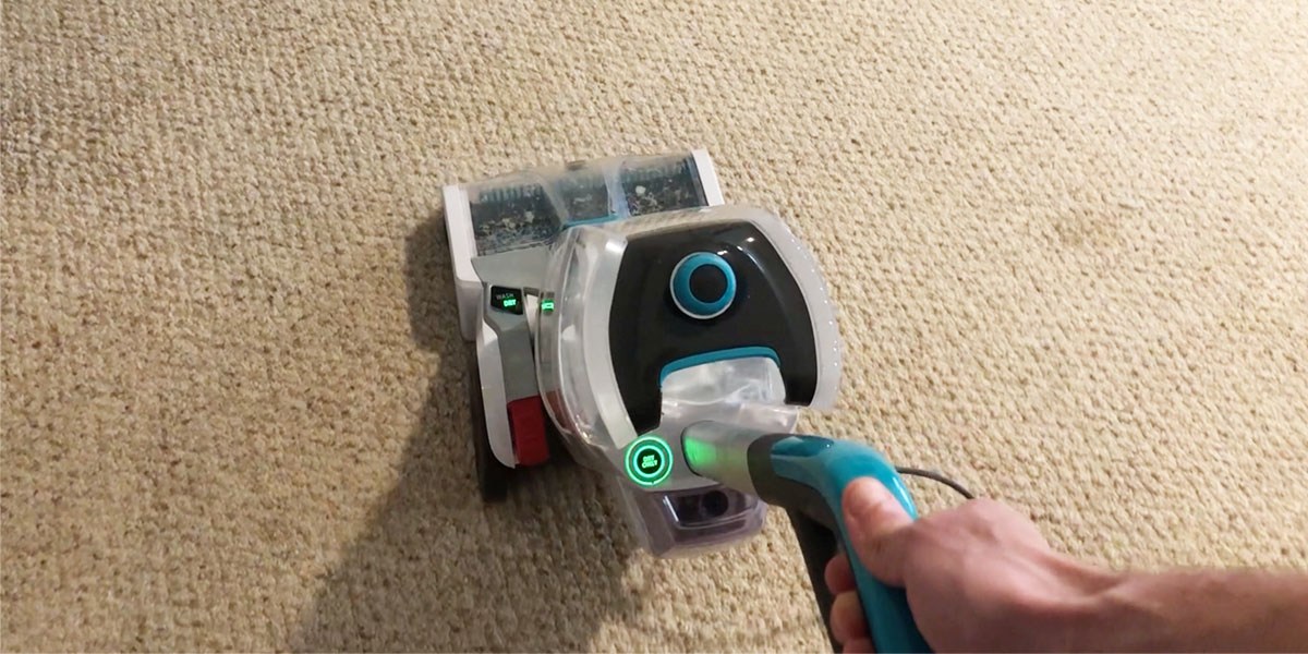 Person using Hoover SmartWash+ HeatForce drying to dry carpet Person using Hoover SmartWash+ HeatForce drying to dry carpet