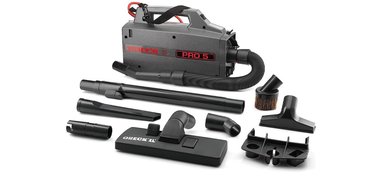 Oreck Commercial XL Pro 5 with attachments on white background