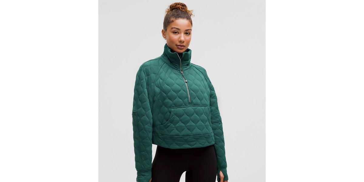 woman in green quilted pull over sweatshirt woman in green quilted pull over sweatshirt
