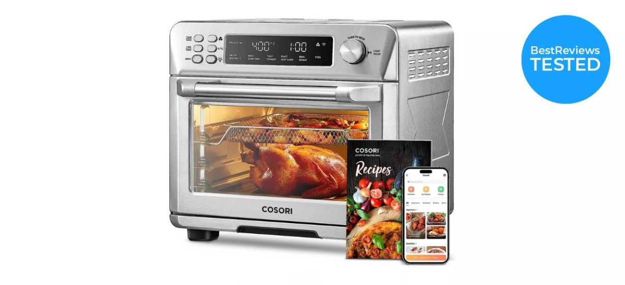 a silver Corsori Toaster Oven–Air Fryer Combo with a recipe book a silver Corsori Toaster Oven–Air Fryer Combo with a recipe book