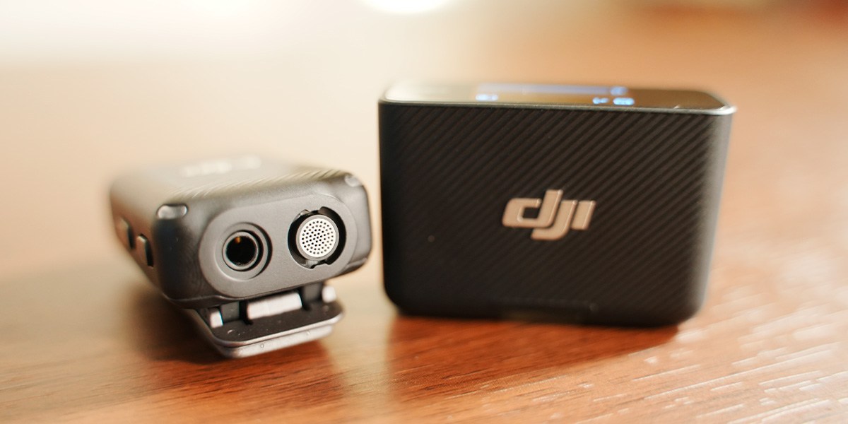 DJI Mic next to carrying case on table DJI Mic next to carrying case on table
