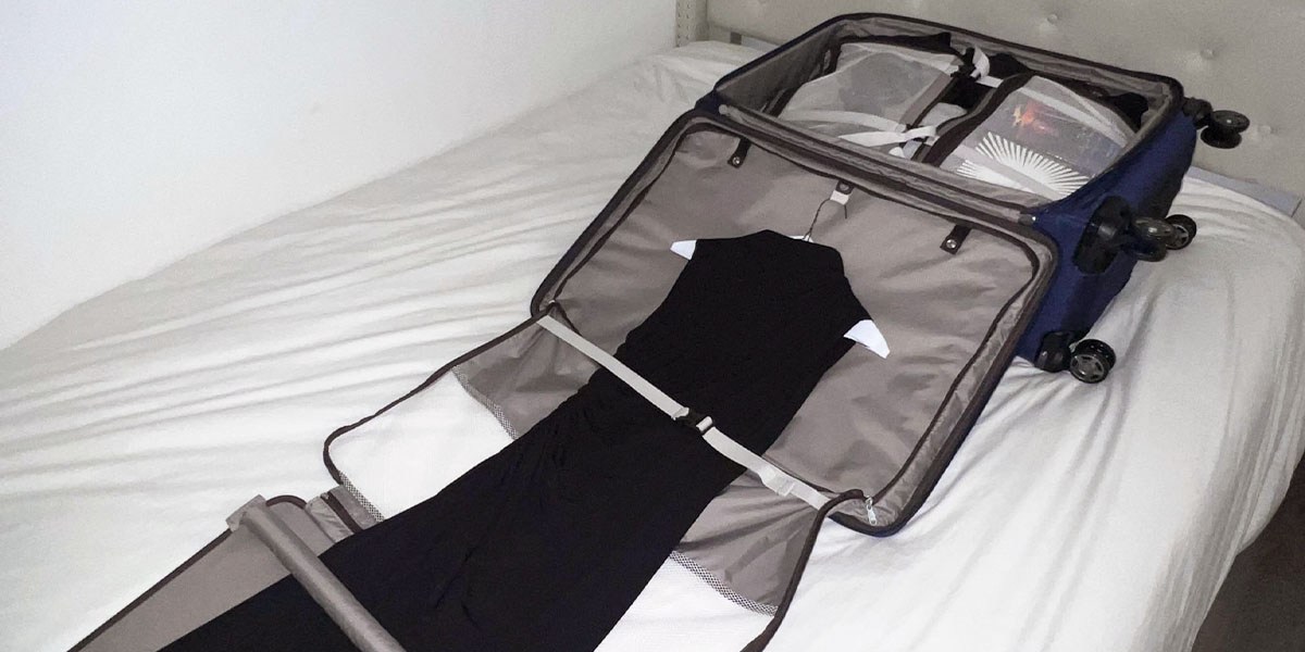 Travelpro Platinum Elite Softside Expandable Check-In Luggage on bed Travelpro Platinum Elite Softside Expandable Check-In Luggage on bed