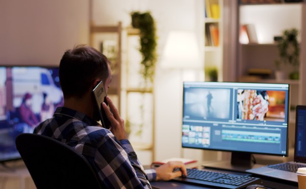 Person playing a video game at a desk