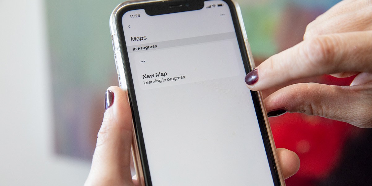 Person using app to operate robotic vacuum