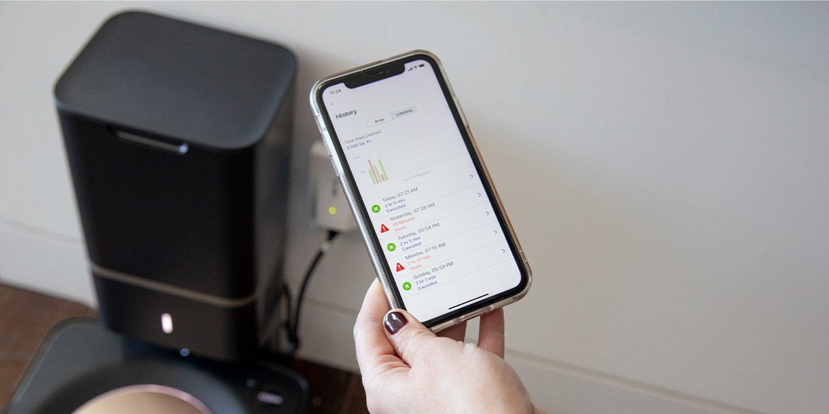 Person using app for Roomba s9+