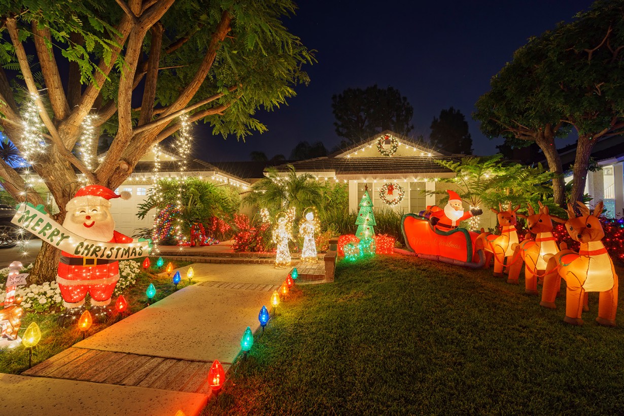 animated Christmas decorations in the front yard of a house