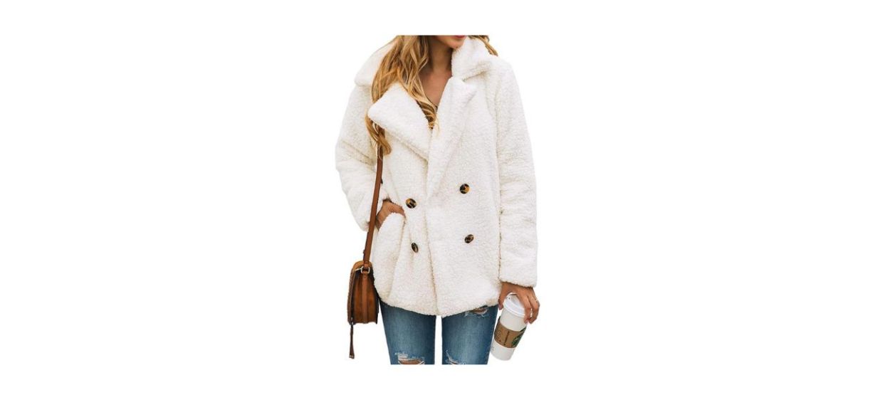 Woman wearing shearling faux fur jacket