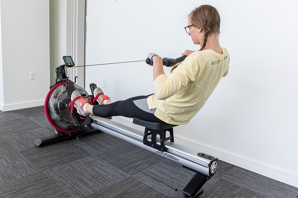 Woman using rowing machine