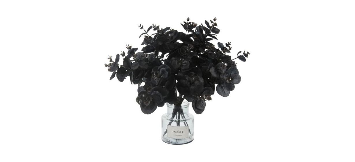 clear vase with a bouquet of artificial black eucalyptus stems in it