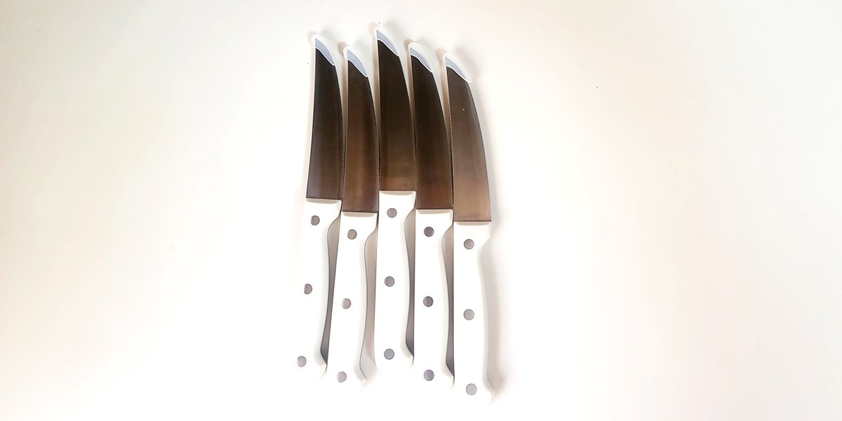 Five Carote 14-Piece Forged Knife Set knives displayed verically on kitchen counter 