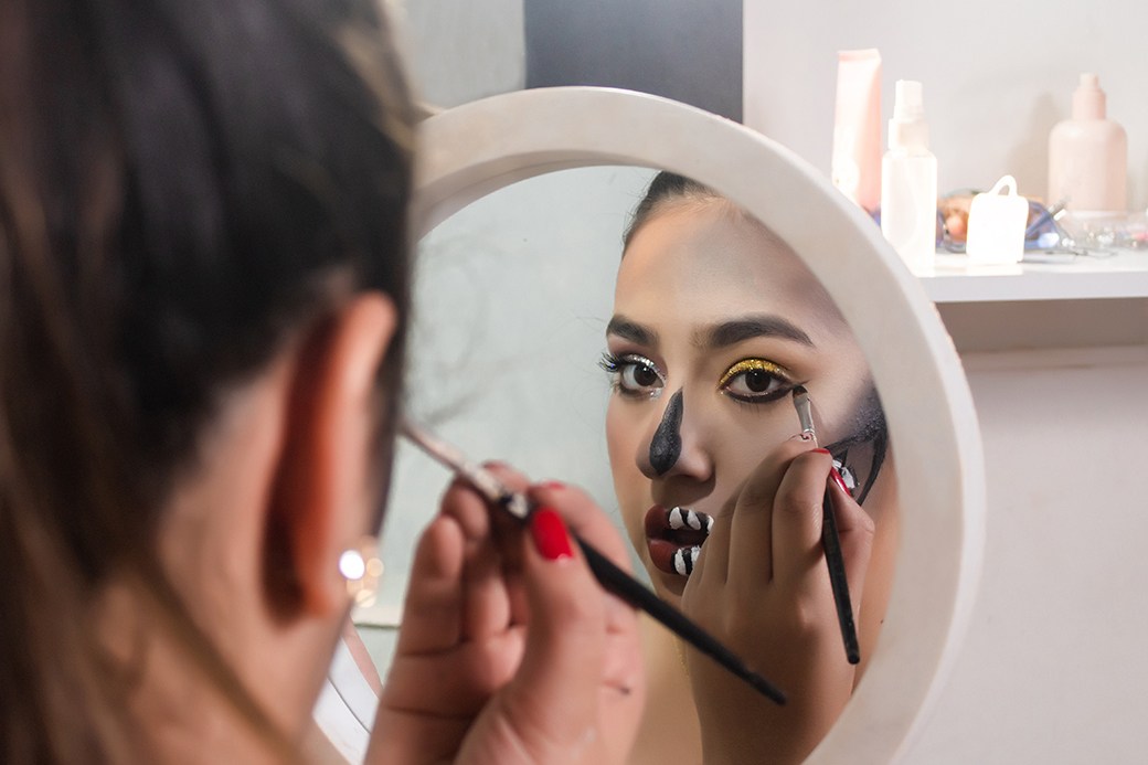Person applying Halloween makeup