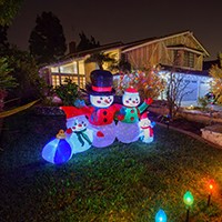 animated Christmas decorations in the front yard of a house