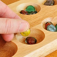 Placing stones in pits